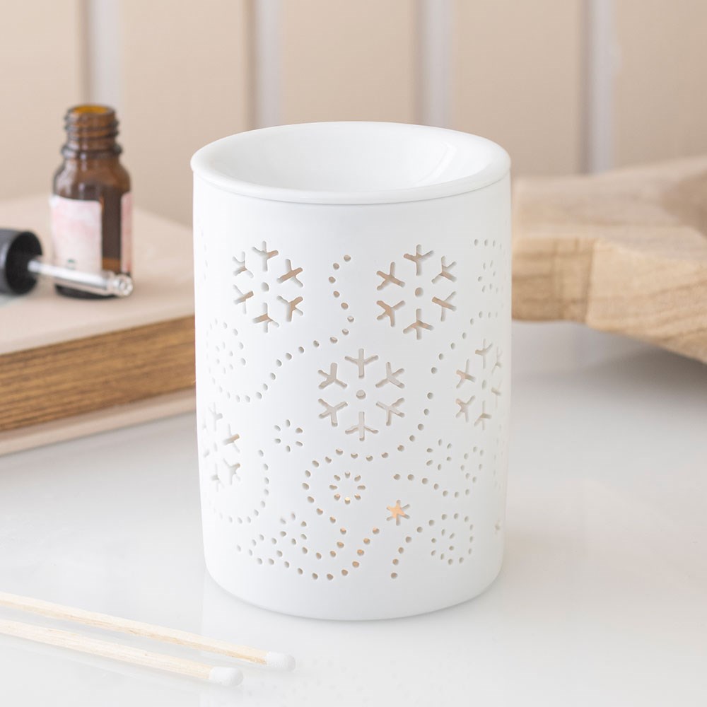 Flocon de neige blanc découpe le brûleur à huile et le chauffe-cire