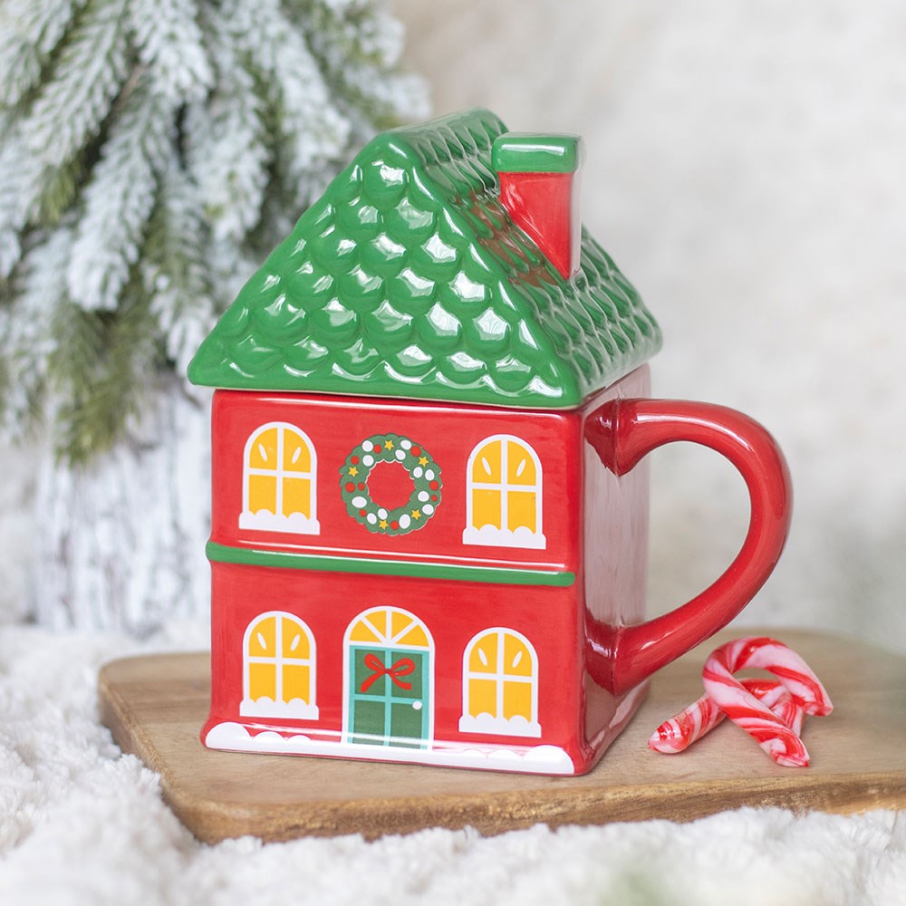 Tasse rouge à couvercle de la maison de Noël